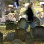 A ghost of a visitor walks through Boston?s historic Granary Burying Ground on a Halloween past.